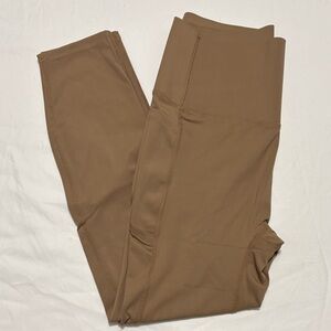 She curve tummy control, butt lifting nude/tan leggings. New, never wore.